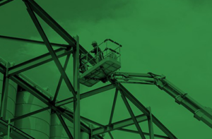 Man going up in a lift to work at height